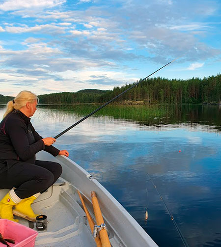 Picture of The traditional Finnish fishing with a hook and line is a nice way to spend a summer day. You're sure to catch something with this method.

It is possible to fish with a line a and hook on all lakes. It is possible to fish with a hook and line from a shore, a jetty or a boat. Nearly all companies in fishing tourism offer hooks and lines and angleworms. Perch, roach and bream are the most common fish that are angled.

If you use a boat for angling you should anchor your boat near the fishing place. An angleworm is set in the hook and the height of the bobber is adjusted to suit the depth of the water. The bobber signals you if a fish bites. You can also make the bait more attractive by pulling the line sometimes if the waves are not strong enough to do this.